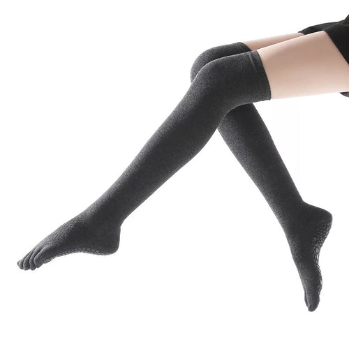 Silicon dots on the bottoms of these overknee socks give you more control in barre and yoga.